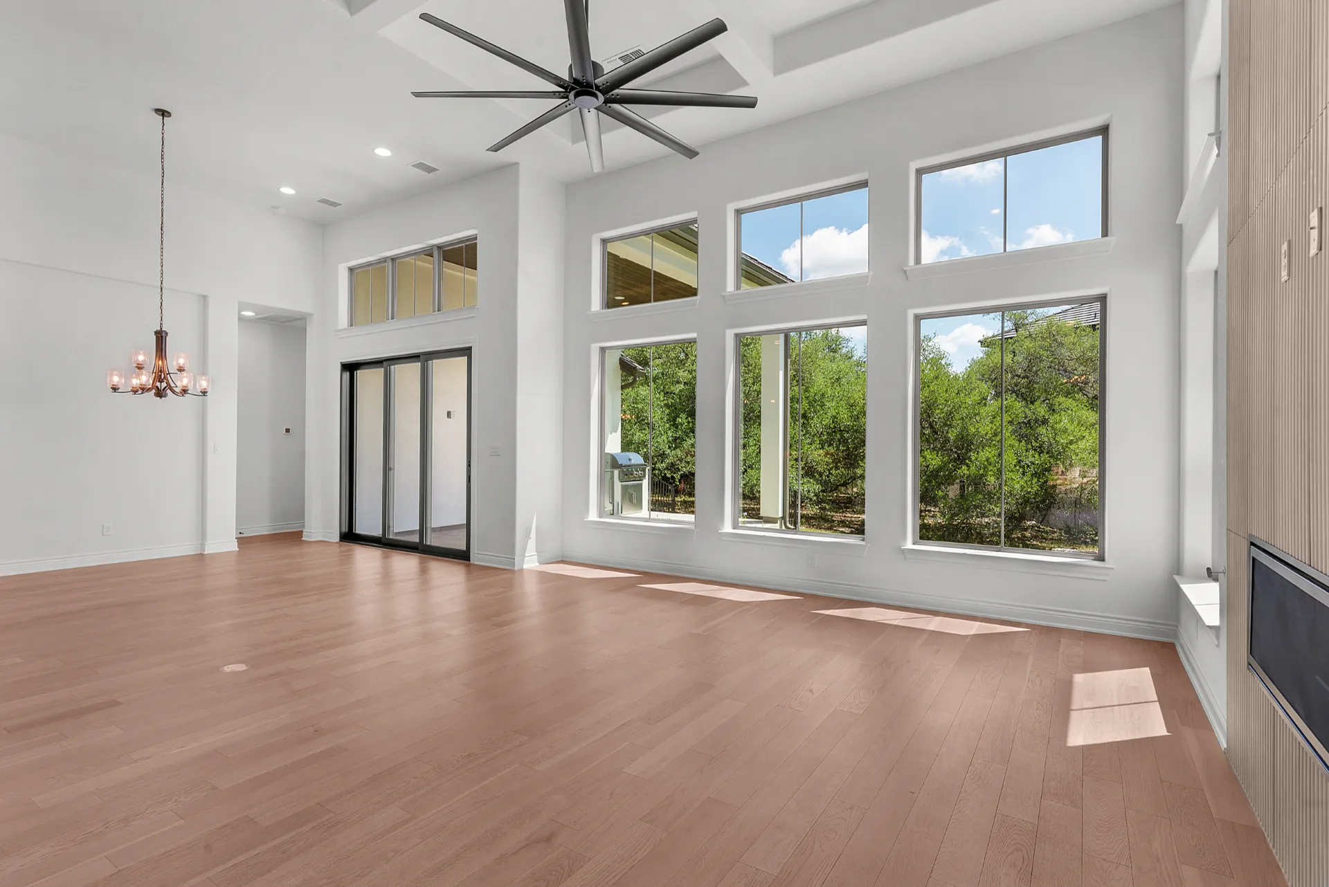 Great room with floor-to-ceiling windows to patio